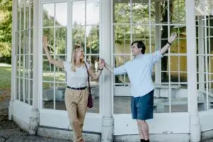 Couple reenacting ‘Sound of Music’ scenes in front of the gazebo at Hellbrunn Palace