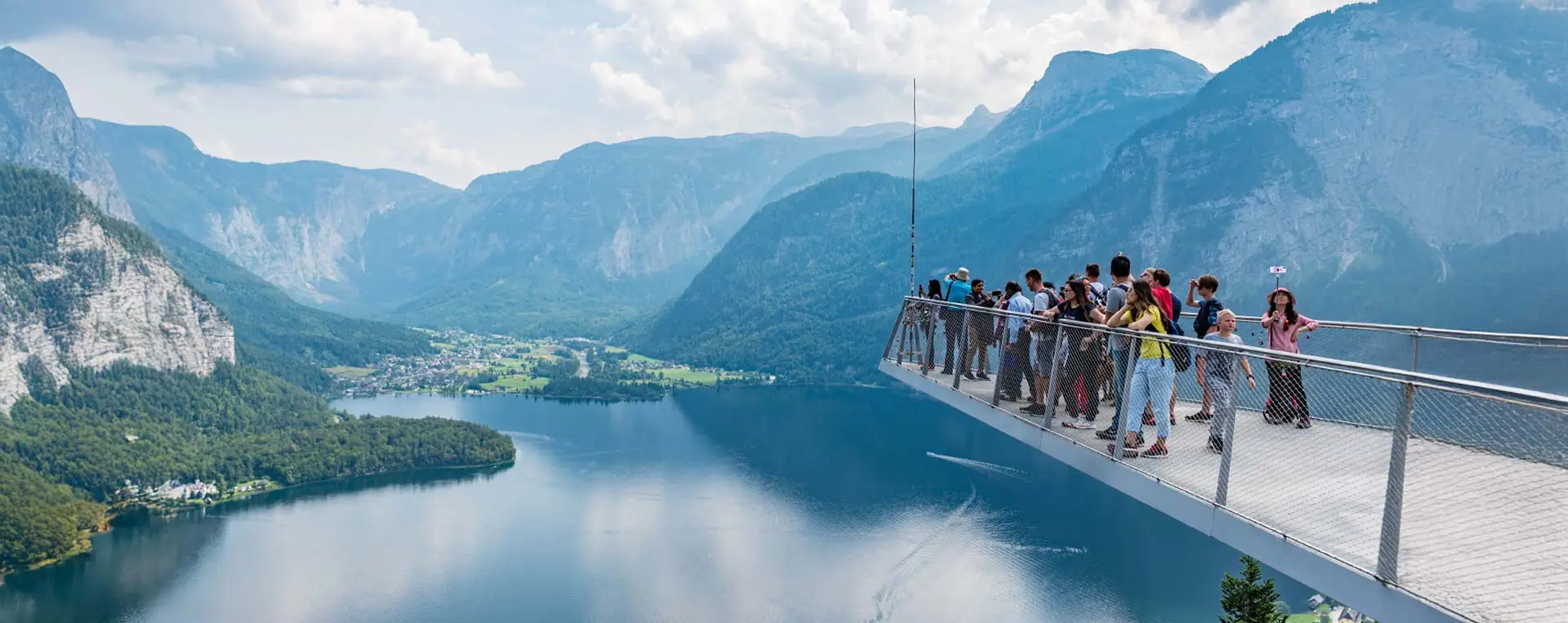 The Skywalk with Lake Hallstatt and the alpine panorama in the background, showcasing breathtaking views.